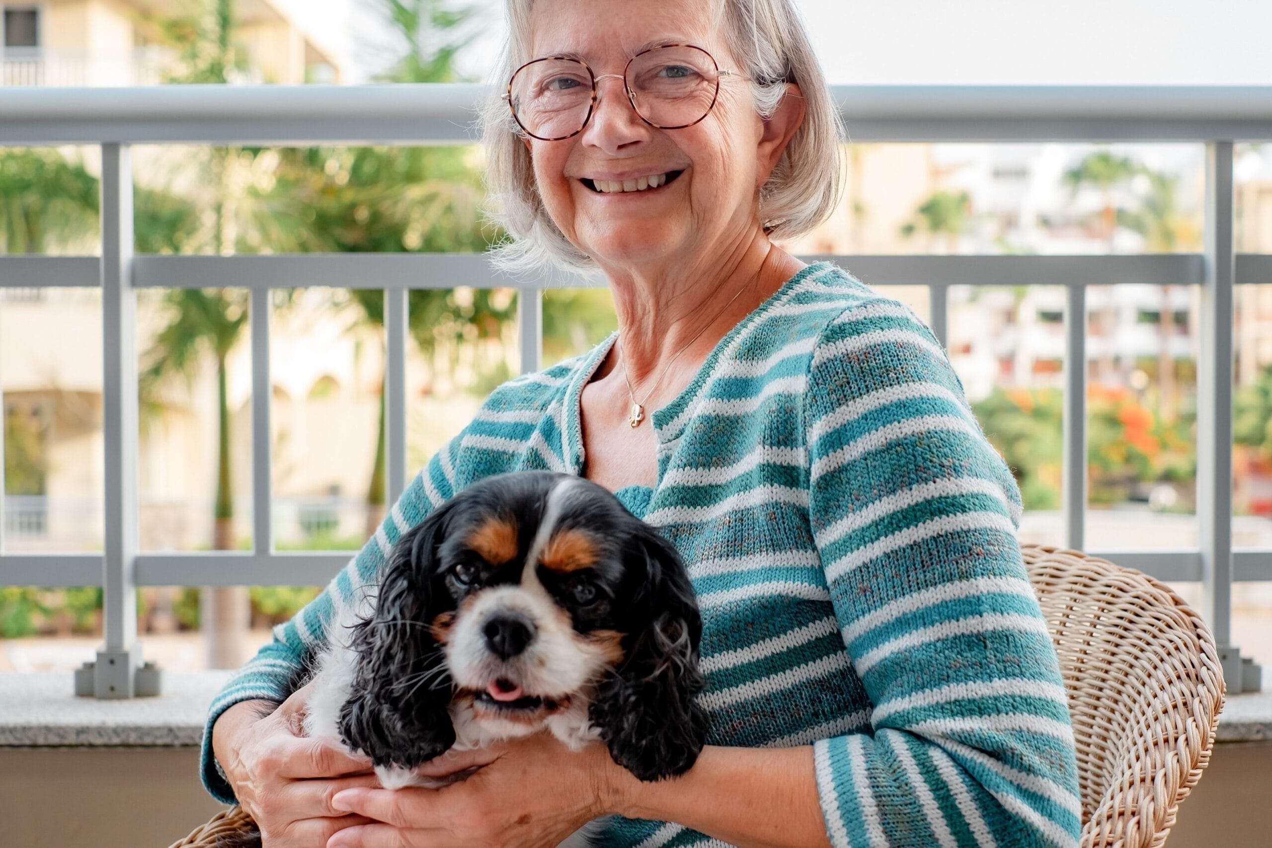 Resident holding a small dog - The Preserve
